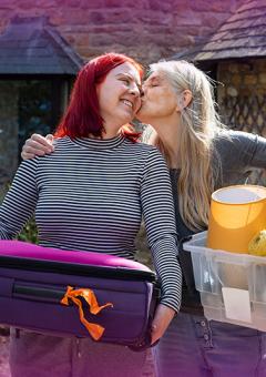 Image of a student and her Mum helping her move to University
