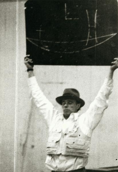 Joseph Beuys holding up a blackboard during his performance event Celtic (Kinloch Rannoch) Scottish Symphony, in studio C.08