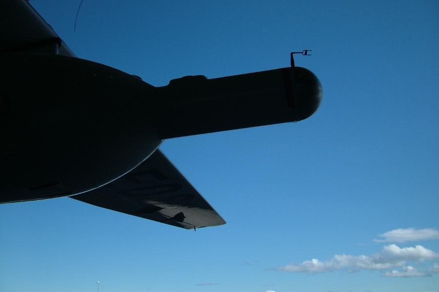 Silhouette of the Dimona's underwing pod with turbulence probe against a blue sky 