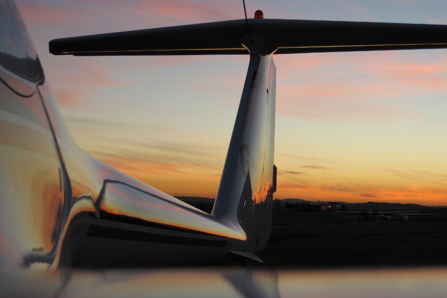 Sun setting behind the ECO-Dimona's tailplane