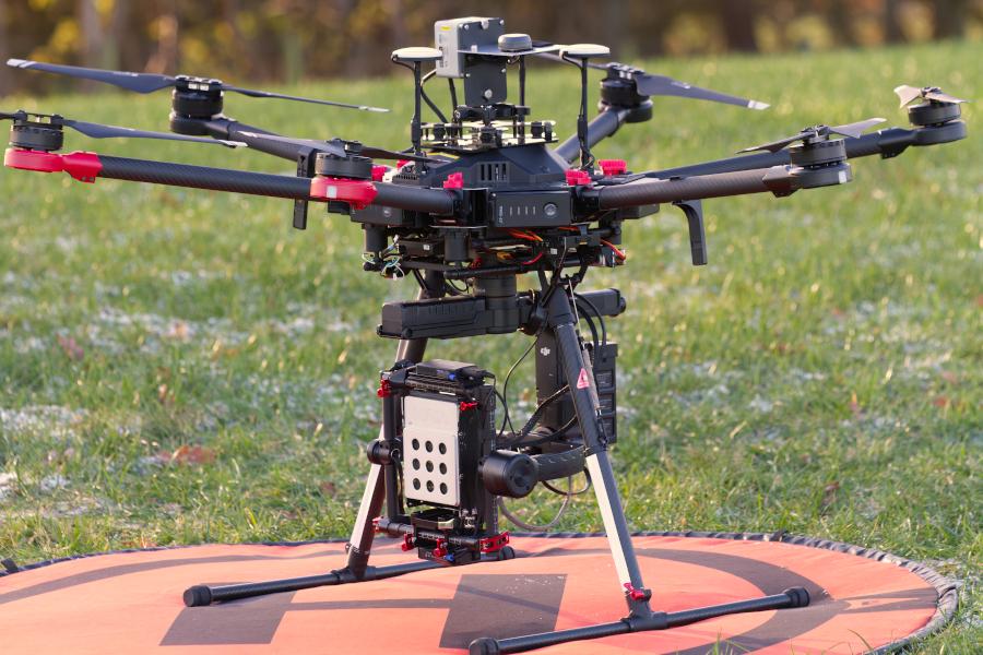 Image of an M600 Pro drone on the ground with Maia multispectral sensor attached