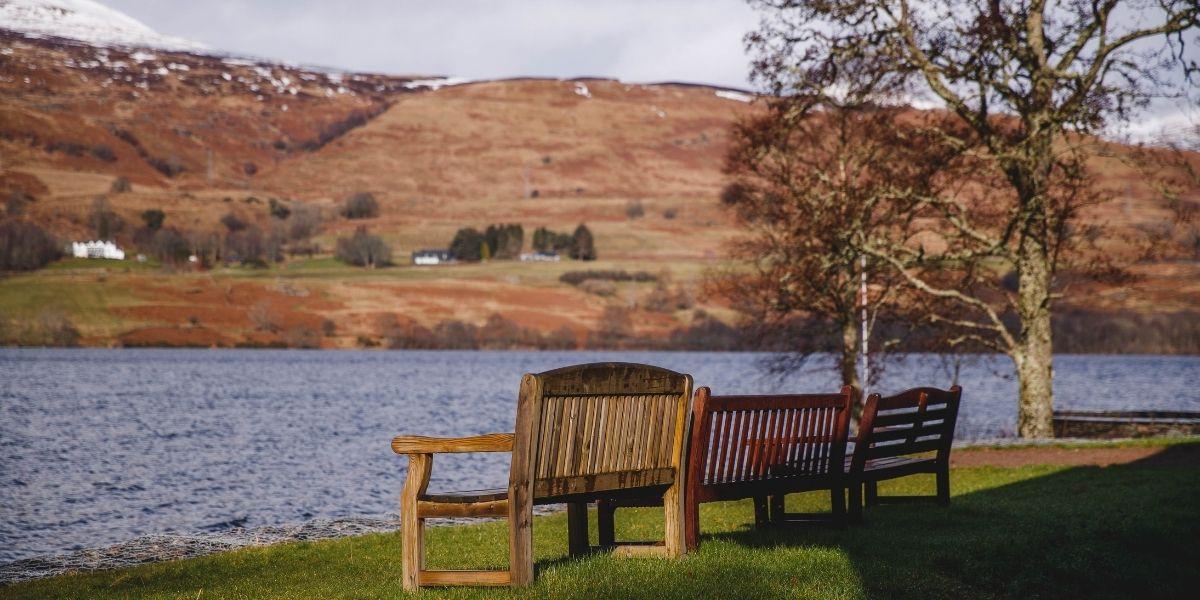 View of benches in front of loch Tay