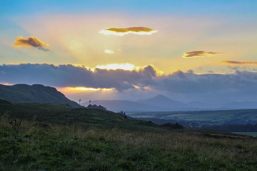 hill with clouds