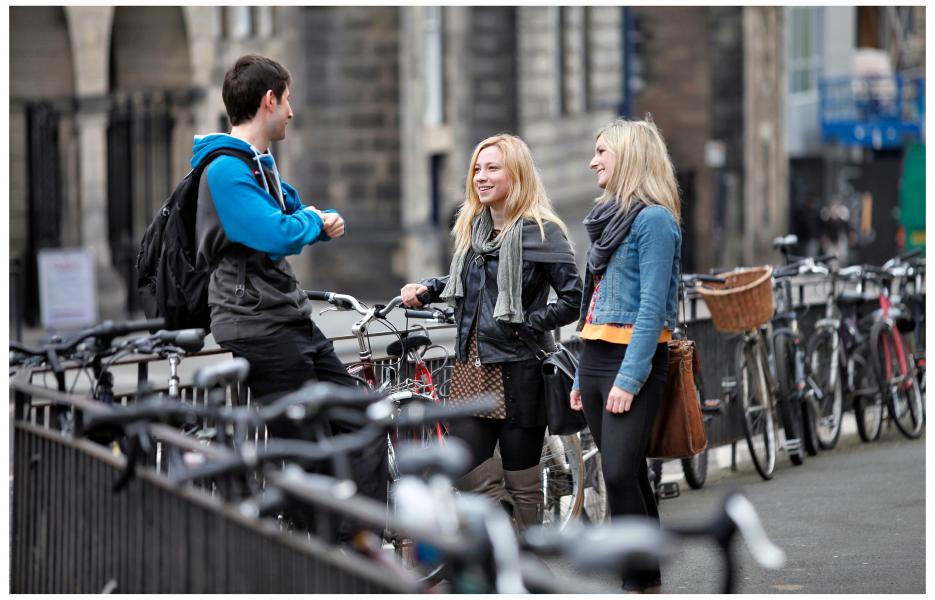 Students with bicycles chatting