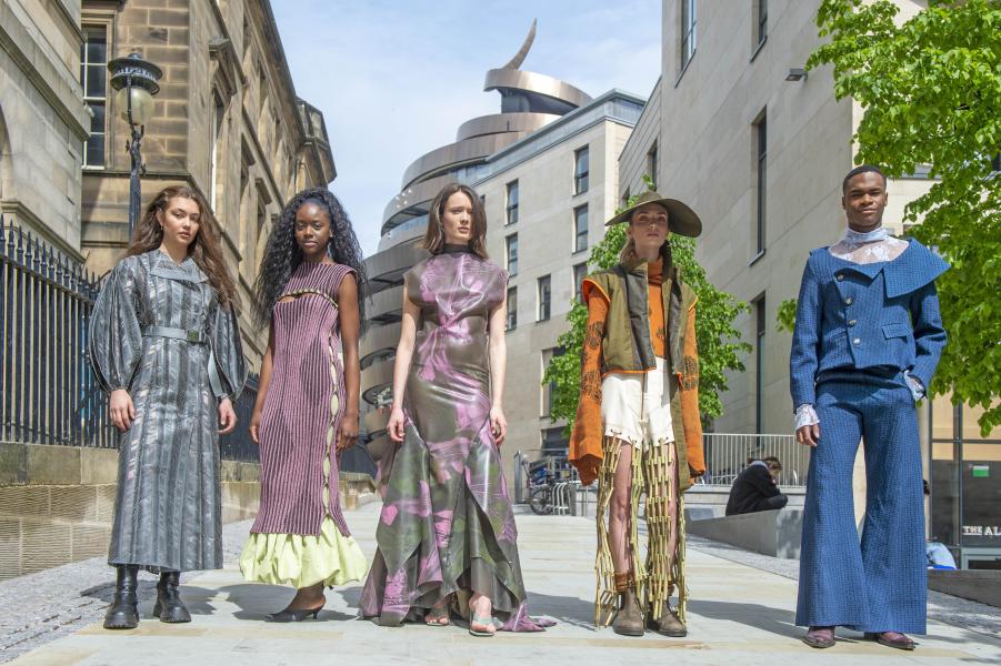 Five models pose in colourful outfits