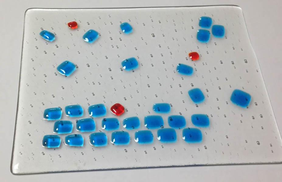 Fused glass designed to show the process of protein crystallisation
