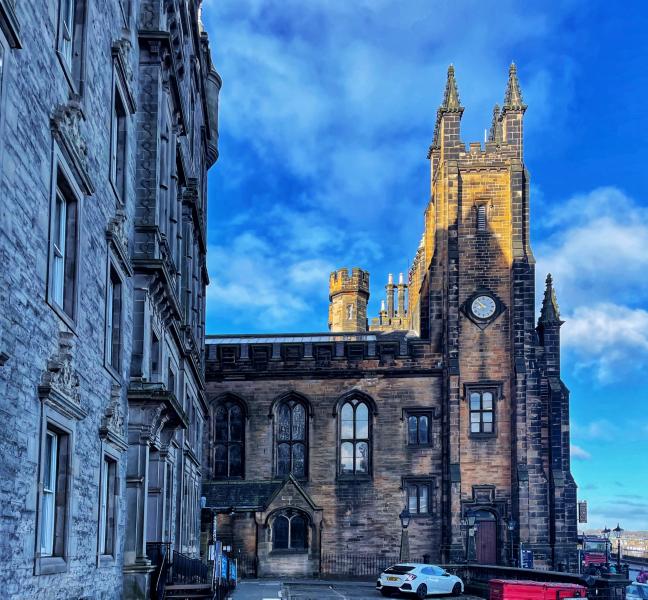 Edinburgh gothic architecture against blue sky