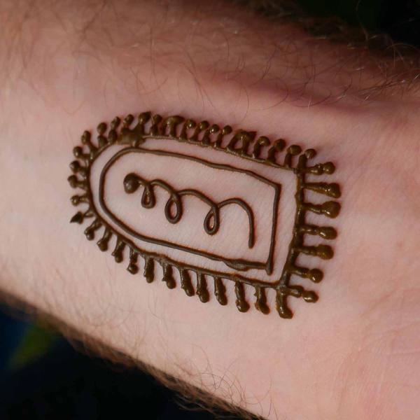 Henna tattoo, of a cell, on an arm