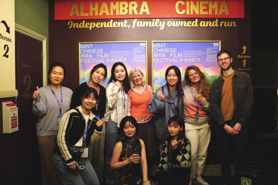 Photo of film festival staff, supporters and volunteers inside a cinema