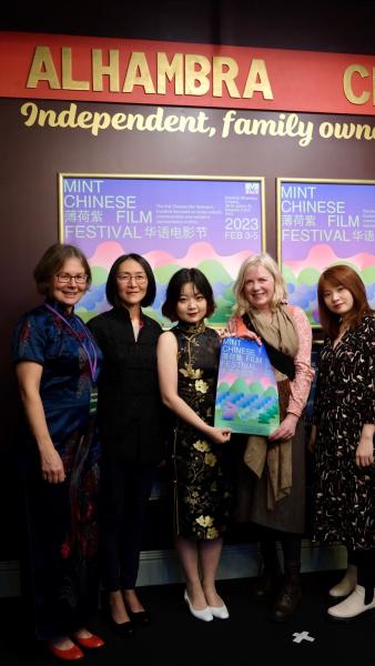 Photo of film festival staff and supporters inside a cinema