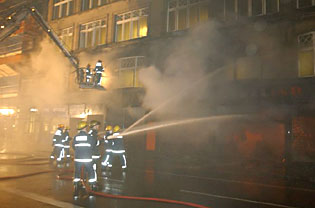 Firefighters at the scene of the Cowgate fire