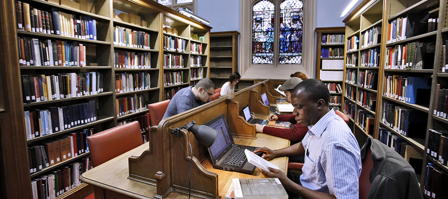 Students studying in New College library