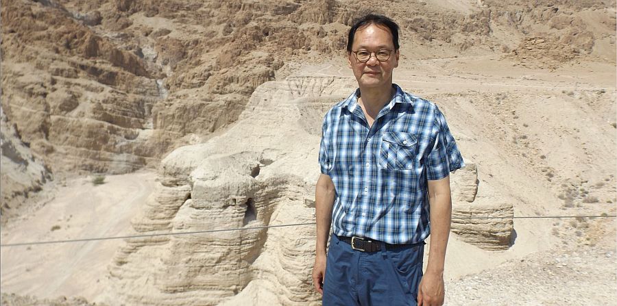 Professor Timothy Lim standing outside the Qumran Caves 